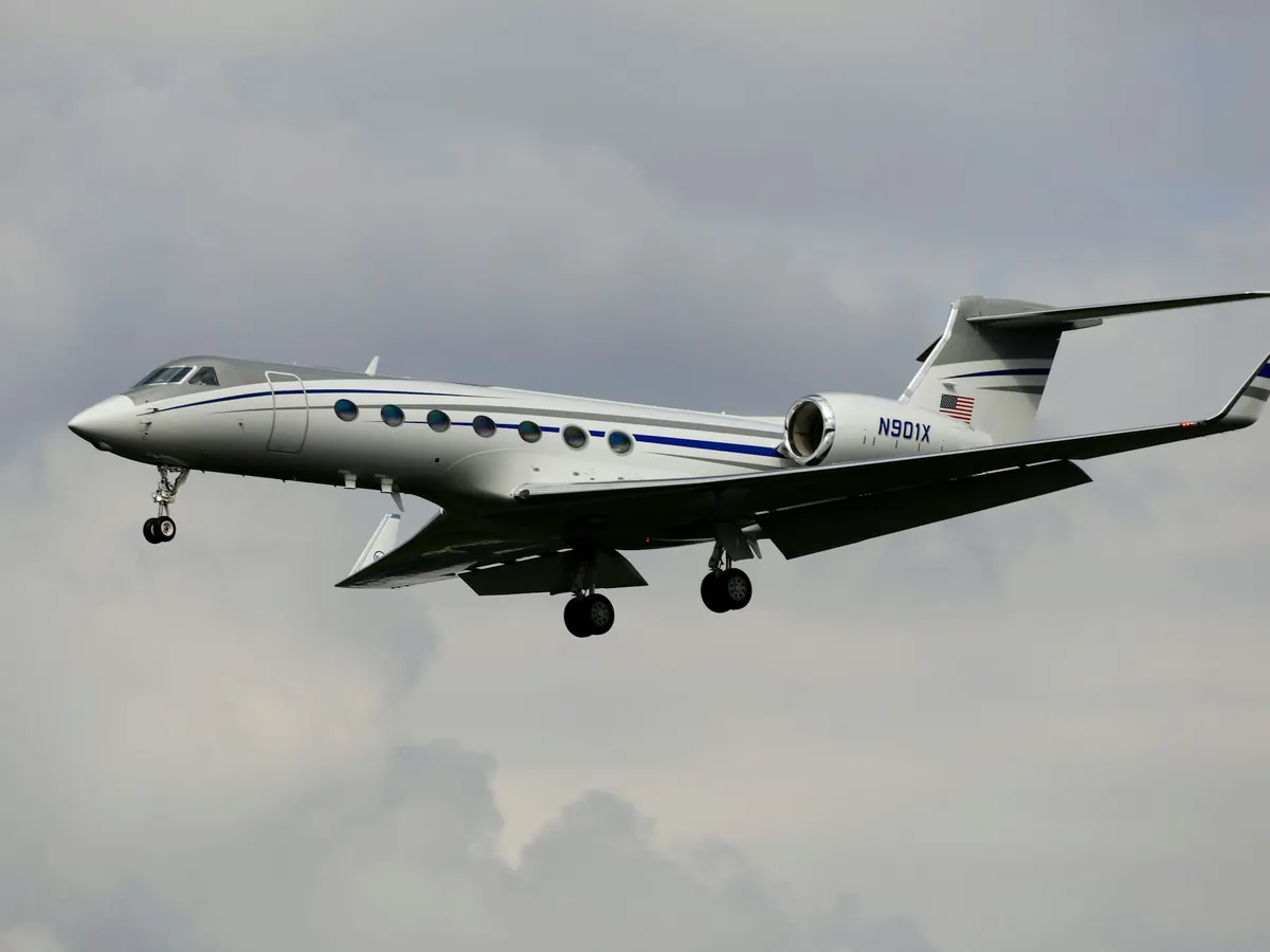 Long-range Gulfstream climbing out over cloud